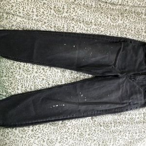 Black, American eagle jeans size 6 has paint speckles